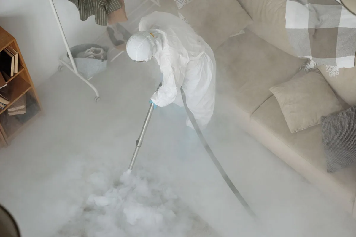 Biohazard cleanup technician in protective equipment, Stratford, WI